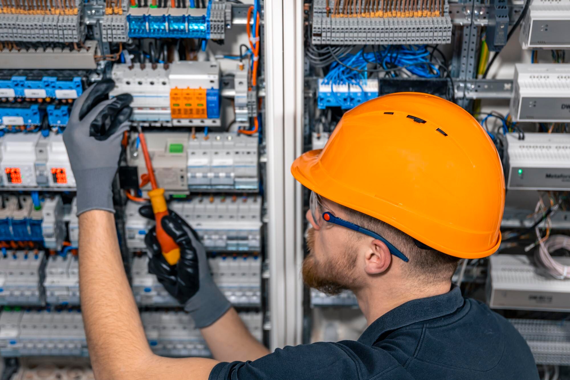 male electrician working switchboard with fuses 169016 55718